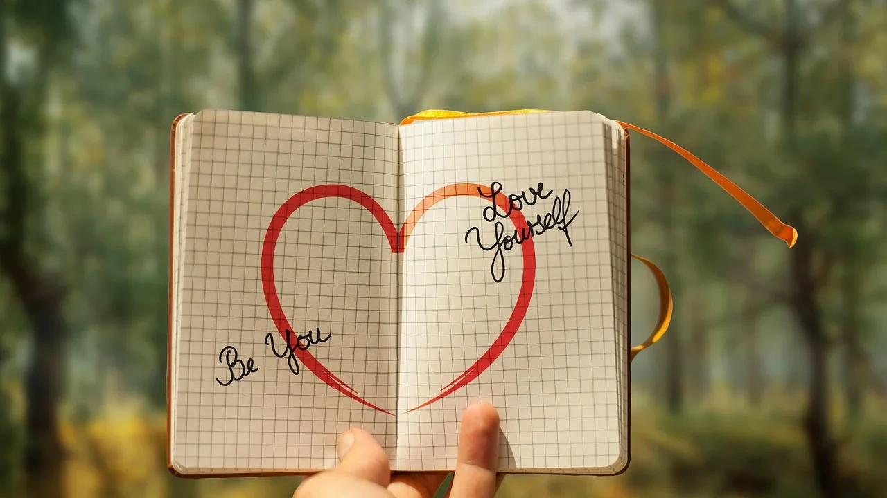 Person Writing Notebook